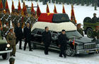 This handout picture taken by North Korea's official Korean Central News Agency (KCNA) on December 28, 2011 shows Kim Jong-Un, center right, and Jang Song-Thaek, center, besides the convoy carrying the body of his father and late leader Kim Jong-Il at Kum 