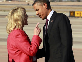 Arizona Gov. Jan Brewer points during an intense conversation with President Obama.