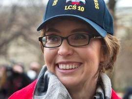 Former Arizona Rep. Gabrielle Giffords attends a ceremony at the Pentagon, Friday, Feb. 10, 2012, for the unveiling of the USS Gabrielle Giffords. The Navy has named a ship for Gabrielle Giffords, the recently retired congresswoman from Arizona who is recovering from a gunshot wound to the head received in January 2011
