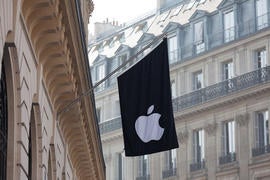 The Apple store in Paris sports the company logo on a flag.