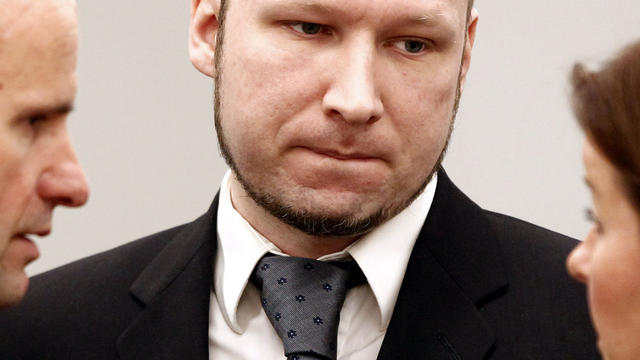 Defendant Anders Behring Breivik talks with defense lawyers Vibeke Hein Baera, right, and Geir Lippestad in court prior to the opening of day 6 of the trial in Oslo, Norway, April 23, 2012. 