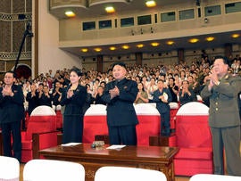North Korean leader Kim Jong Un, center right, and others clap as they watch performance by North Korea's new Moranbong band in Pyongyang, North Korea, Friday, July 6, 2012.