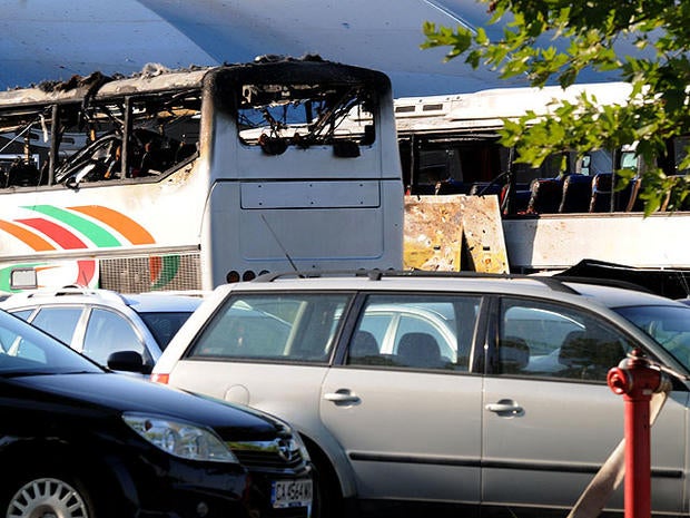 Destroyed buses are seen at Burgas airport, outside the Black Sea city of Burgas, Bulgaria, some 250 miles east of the capital, Sofia, Wednesday, July 18, 2012.