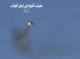 Syrian rebels claim this image, taken from a video, shows shows a government Soviet-made MiG warplane catching fire apparently after it was hit by ground fire. Syrian governments said the plane malfunctioned.