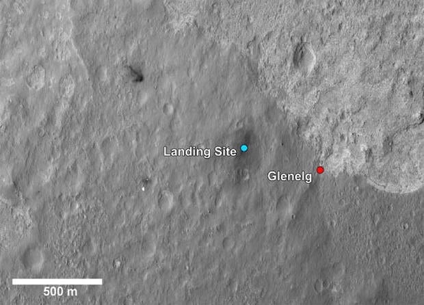 This image shows a closer view of the landing site of NASA's Curiosity rover and a destination nearby known as Glenelg. Curiosity landed inside Gale Crater on Mars on Aug. 5 PDT (Aug. 6 EDT) at the blue dot. It is planning on driving to an area marked with a red dot that is nicknamed Glenelg. That area marks the intersection of three kinds of terrain. Starting clockwise from the top of this image, scientists are interested in this brighter terrain because it may represent a kind of bedrock suitable for eventual drilling by Curiosity. The next terrain shows the marks of many small craters and intrigues scientists because it might represent an older or harder surface. The third, which is the kind of terrain Curiosity landed in, is interesting because scientists can try to determine if the same kind of rock texture at Goulburn, an area where blasts from the descent stage rocket engines scoured away some of the surface, also occurs at Glenelg. The science team thought the name Glenelg was appropriate because, if Curiosity traveled there, it would visit the area twice -- both coming and going -- and the word Glenelg is a palindrome. After Glenelg, the rover will aim to drive to the base of Mount Sharp. These annotations have been made on top of an image acquired by the High Resolution Imaging Science Experiment on NASA's Mars Reconnaissance Orbiter. Image credit: NASA/JPL-Caltech/Univ. of Arizona