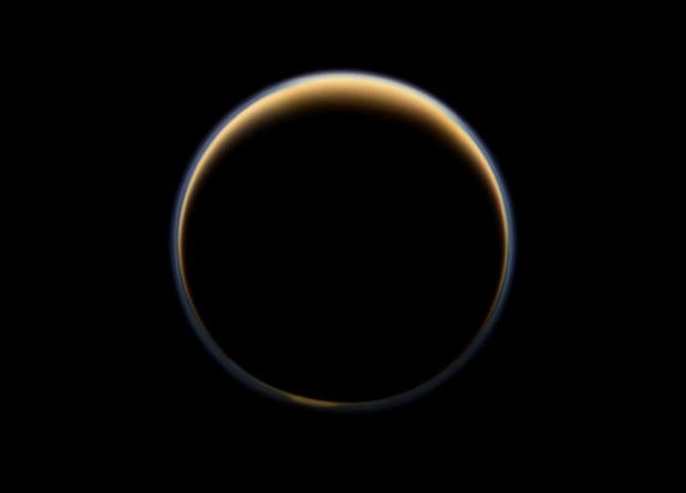 NASA's Cassini spacecraft looks toward the night side of Saturn's moon Titan and sees sunlight scattering its atmosphere, forming a colorful ring. The images were acquired on June 6, 2012, when Cassini was about 134,000 miles from Titan.