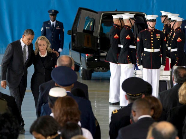 President Obama and Secretary of State Hillary Rodham Clinton walk back to their seats after speaking during a transfer of remains ceremony Sept. 14, 2012, at Andrews Air Force Base, Md., marking the return to the United States of the remains of four Americans killed in Benghazi, Libya.