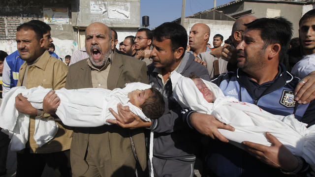 Gazans carry the bodies of children killed in Israeli air strikes. 