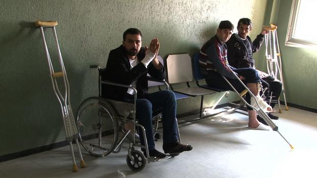 Wounded Syrians at Tishereen military hospital in norther Damascus, Syria.