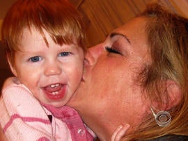 Kim Summers and the Russian child she and her husband had planned to adopt.