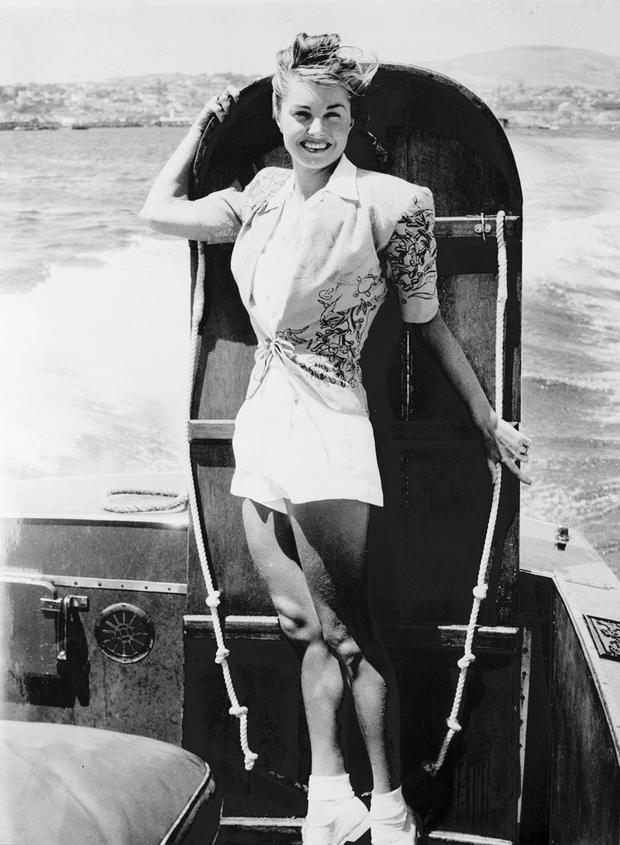 American movie star Esther Williams poses with a b 