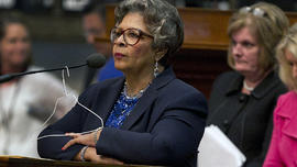 Rep. Senfronia Thompson, D-Houston, stands at the podium where she has hung a hanger from the microphone on the House floor as she attempts to add an amendment to create an exception for victims of rape and incest in Senate Bill 5 during debate at the State Capitol in Austin, Texas, on Sunday, June 23, 2013.