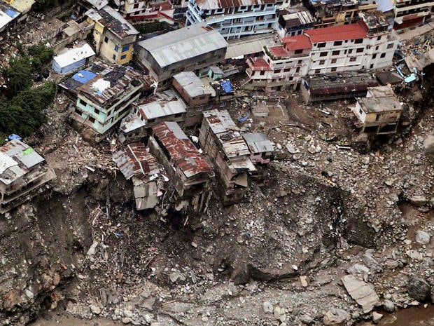 Damaged houses are seen following monsoon rains in Shrinagar, India