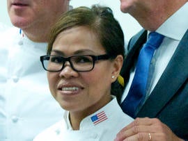 President Obama's executive chef, Cristeta Comerford, meets with members of the Club des Chefs des Chefs - chefs to the world's presidents and potentates - at United Nations headquarters in New York July 29, 2013.