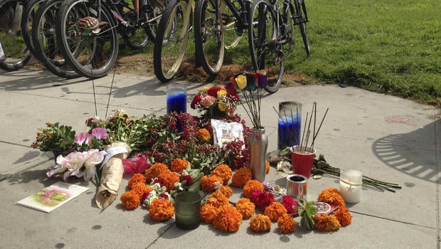A makeshift memorial along the Venice, Calif., beach boardwalk is shown Sunday Aug. 4, 2013 near where a Saturday incident involving a driver who accelerated through a crowd of beachgoers, hitting one person after another as bystanders tried desperately to get out of the way. The hit-and-run killed an Italian woman on her honeymoon and hurt 11 others.