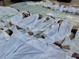 The bodies of people killed in an alleged "poisonous gas" attack are seen in a makeshift morgue in the eastern Ghouta suburbs of Damascus