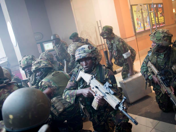 Armed police leave after entering the Westgate Mall in Nairobi, Kenya, Sept. 21, 2013.