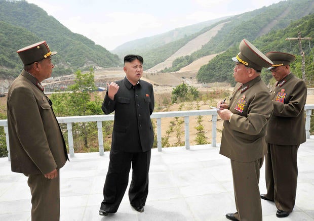 North Korean leader Kim Jong-Un speaks other officials at the Masik Pass Skiing Ground