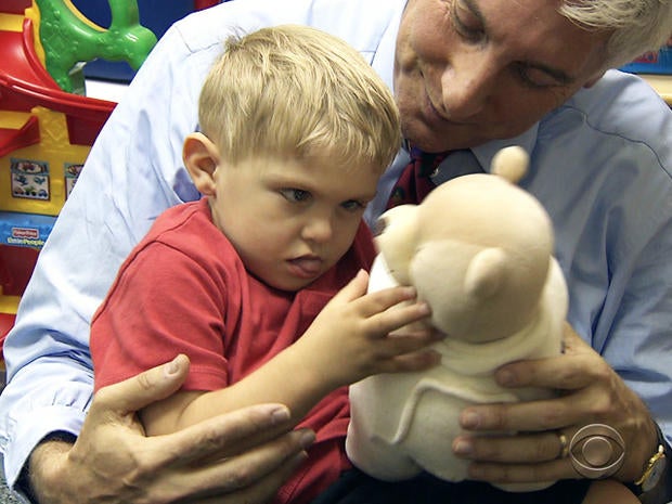 Grayson plays with Dr. Jon LaPook.