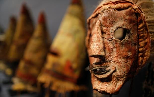 A rare antique tribal mask, Kachina Hapota, circa 1910-1920, revered as a sacred ritual artifact by the Native American Hopi tribe in Arizona is displayed at the Drouot auction house in Paris before auction, December 9, 2013. The Hopi, some of whose 18,000 members continue to follow a traditional way of life farming on three isolated mesas, believe the bright, mostly fabric masks are imbued with the spirits of divine messengers.
