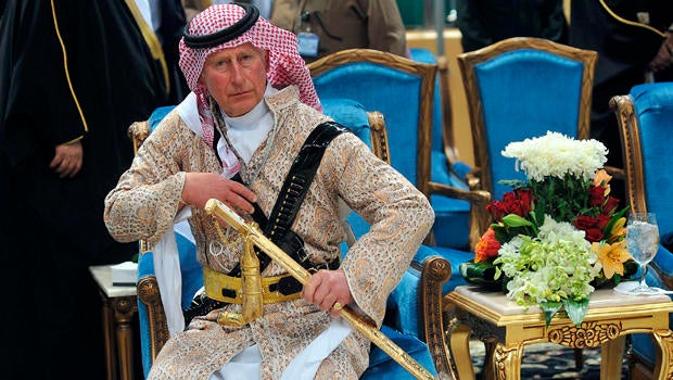 Britain's Prince Charles, wearing a traditional Saudi attire, attends the traditional Saudi dance known as "Arda," which was performed during Janadriya culture festival at Der'iya in Riyadh, Saudi Arabia, Feb. 18, 2014.