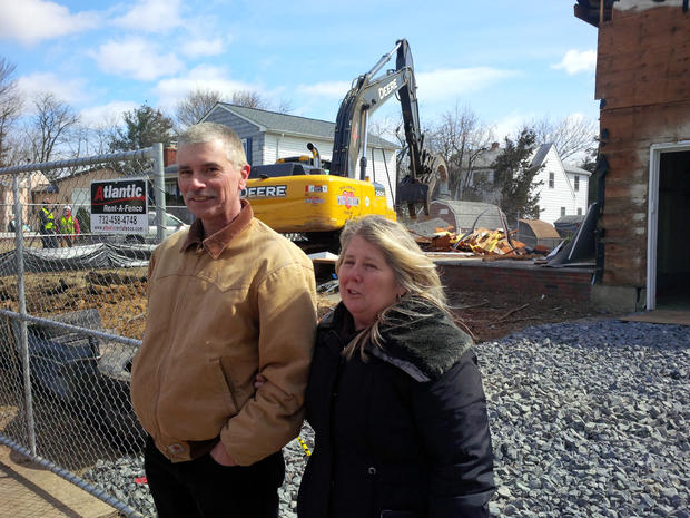 Sayreville residents stand in front of home being demolished as part of state buyout program 