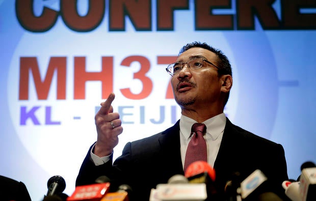 Malaysia's Minister of Transport Hishamuddin Hussein takes questions from the media during a press conference about the missing Malaysia Airlines jetliner MH370