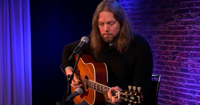 Rich Robinson performs "Down The Road" CBS News