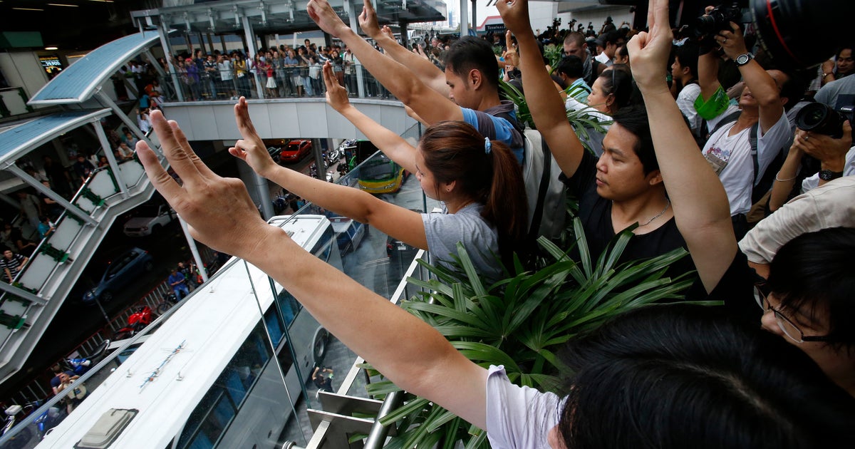 Thai protestors use Hunger Games hand gesture CBS News