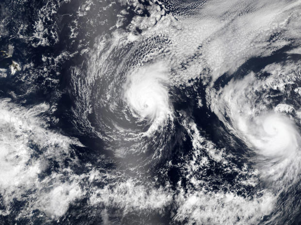 Hurricane Iselle and Hurricane Julio, right, are pictured en route to Hawaii, upper left, Aug. 5, 2014, in this NASA handout satellite image. 