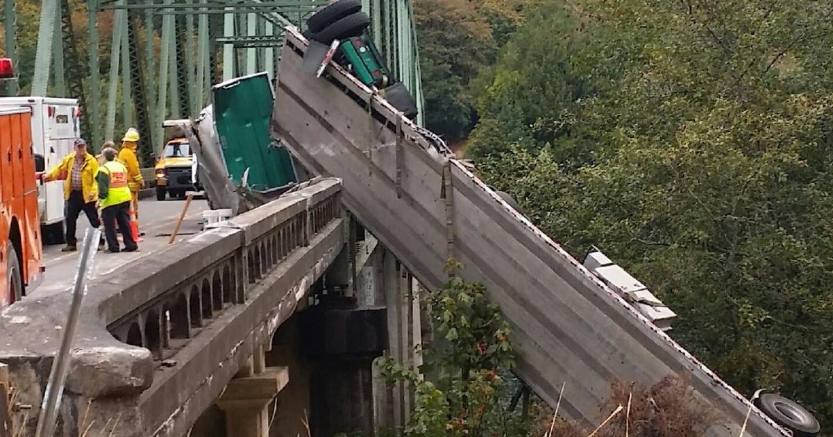 Crash sends truck dangling over Oregon bridge rail CBS News