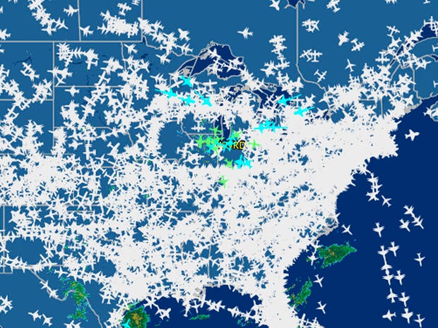 This screenshot provided by FlightAware shows airline traffic at 10:20 a.m. EDT over the United States Sept. 26, 2014, after hundreds of flights were canceled at Chicago airports, at center, following a fire at a suburban Chicago air traffic control faci