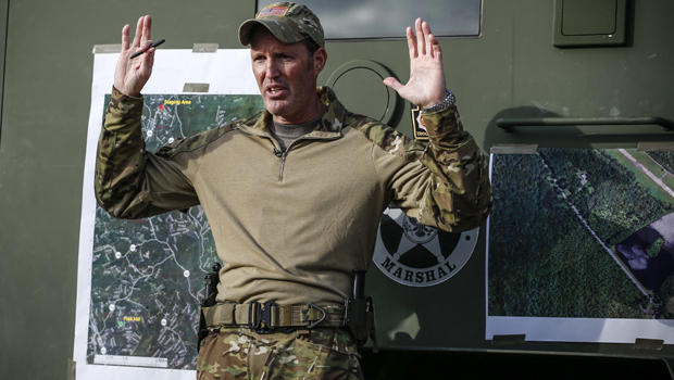 Scott Malkowski, a task force commander with the U.S. Marshals Service, Special Operations Group, gestures as he explains how Eric Matthew Frein reacted when he was captured while Malkowski talks with members of the media Oct. 31, 2014, in Cresco, Pennsyl 