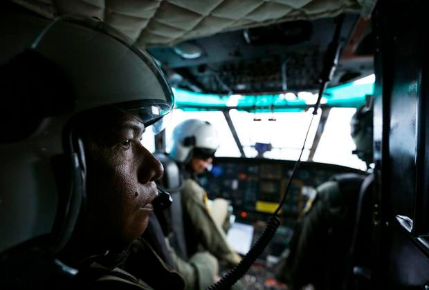 Indonesia Air Force members are seen inside a Super Puma helicopter during search of Java Sea, off Indonesia, on January 7, 2015, for passengers from AirAsia Flight 8501