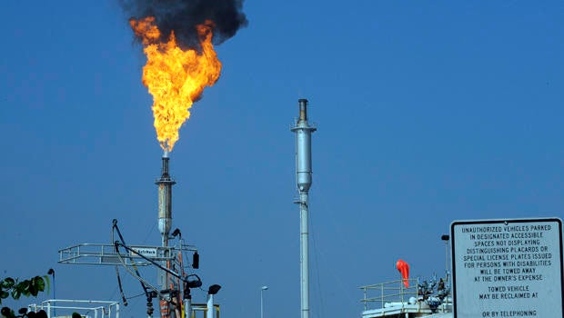 Flames leap from a burner unit after an explosion at the Exxon-Mobil refinery in Torrance, California, Feb. 18, 2015.