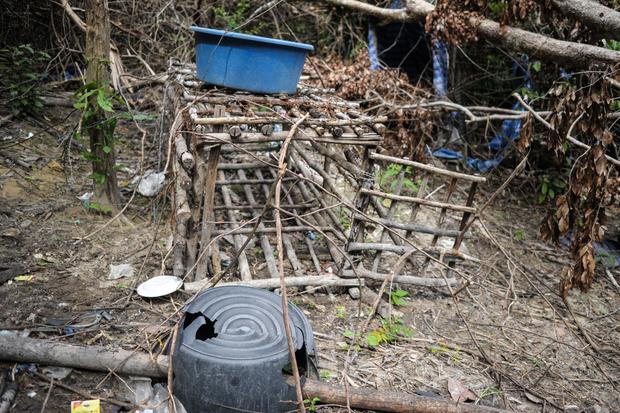 A small cage is seen at an abandoned migrant camp used by human traffickers in a jungle at Bukit Wang Burma in the Malaysian northern state of Perlis, which borders Thailand