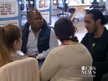 Wayra U.K. Director Gary Stewart (second from the left) speaks with tech start-up employees at the Wayra Accelerator in London