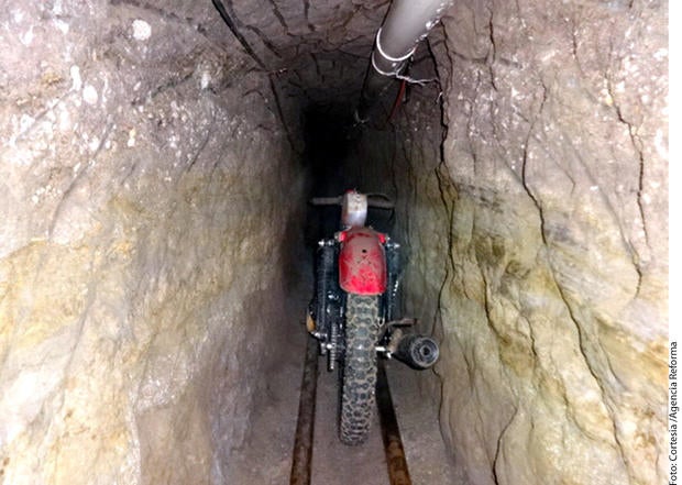 A motorcycle sits on rails inside the alleged escape tunnel that was constructed three stories underground through dirt and rock for Joaquin "El Chapo" Guzman's escape from a Mexican prison in 2015.