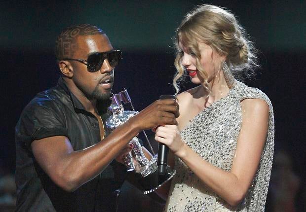 September 2009 file photo shows Kanye West taking microphone from Taylor Swift as she accepts "Best Female Video" award during MTV Video Music Awards in New York