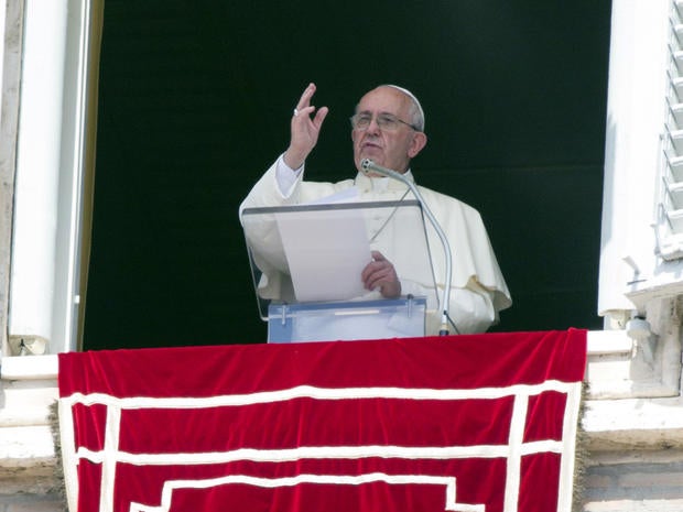 Pope Francis delivers his blessing to faithful during the Angelus noon prayer from his studio window overlooking St. Peter's Square