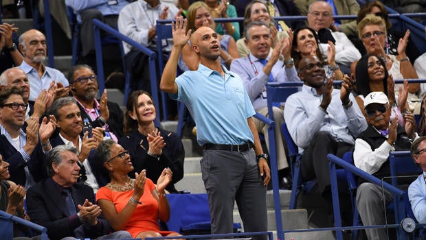 Former tennis player James Blake acknowledges the crowd during the match between Roger Federer of Switzerland and Stan Wawrinka of Switzerland on day 12 of the 2015 U.S. Open tennis tournament at USTA Billie Jean King National Tennis Center in New York.