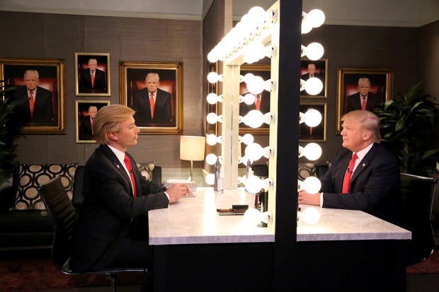 In this image released by NBC, host Jimmy Fallon, left, and Republican presidential candidate Donald Trump appear in the "Trump in the Mirror" skit during a taping of "The Tonight Show" Sept. 11, 2015, in New York.
