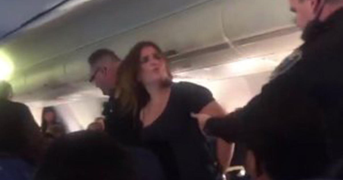 American Airlines Flight Diverted After Woman Strikes Passenger Flight Attendant Cbs News