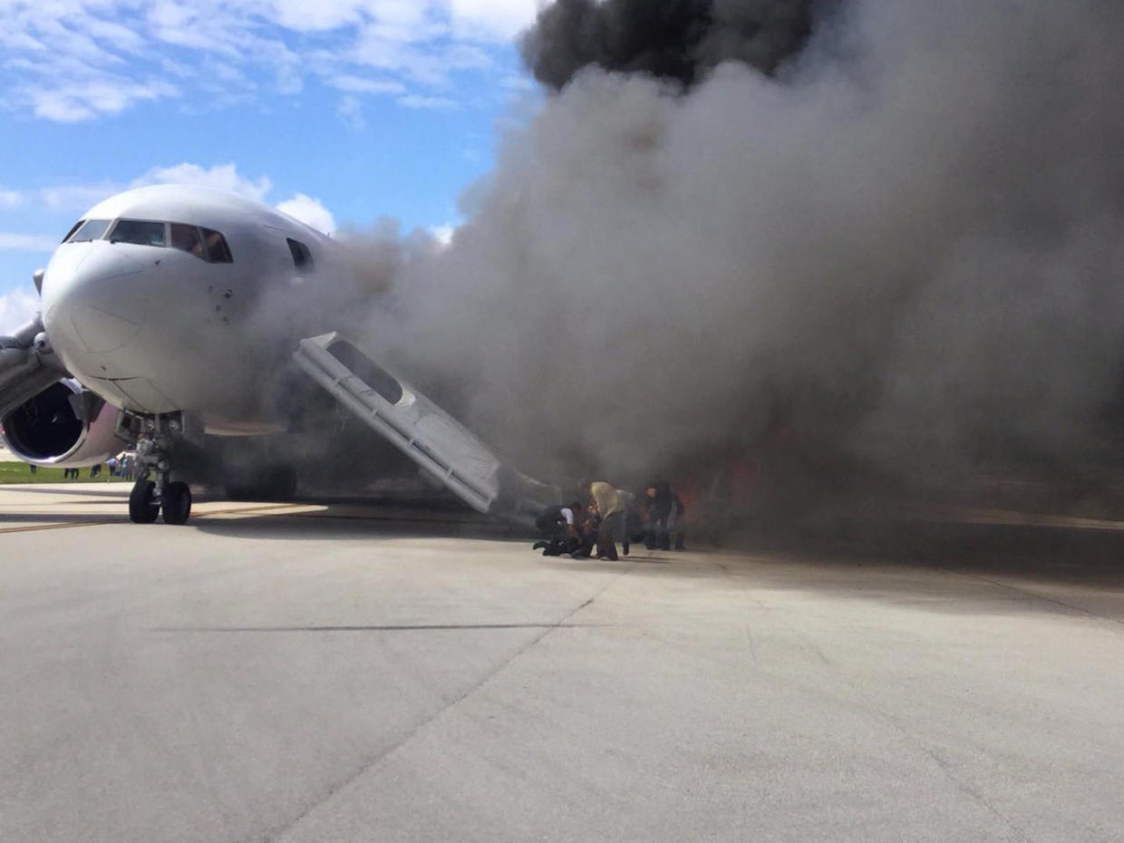 Passengers on Dynamic Airways plane that burned on Florida runway tell
