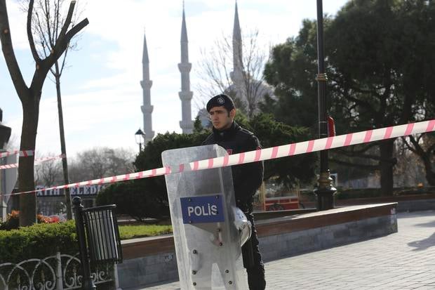 A police officer secures the area after an explosion near the Ottoman-era Sultanahmet mosque, known as the Blue mosque in Istanbul