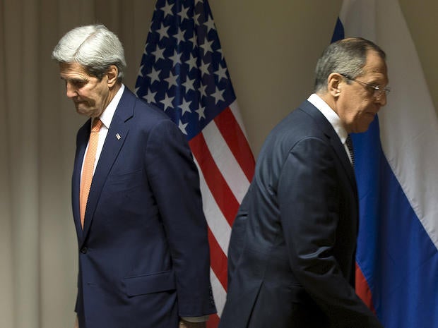 U.S. Secretary of State John Kerry and Russian Foreign Minister Sergey Lavrov walk to their seats for a meeting about Syria in Zurich, Switzerland, Jan. 20, 2016.