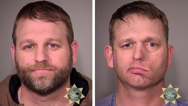 Ammon Bundy, left, and his brother, Ryan Bundy, are seen in a combination of police jail booking photos released by the Multnomah County Sheriff's Office in Portland, Oregon, Jan. 27, 2016.