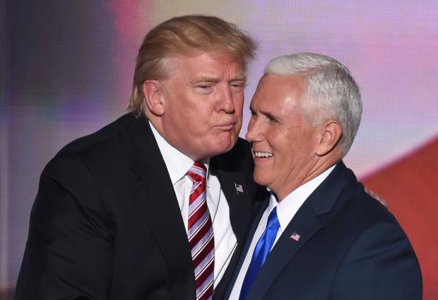 It was the missed kiss heard around the world. Republican presidential candidate Donald Trump tries to kiss vice presidential candidate Mike Pence after his speech at the RNC in Cleveland on July 20, 2016. 