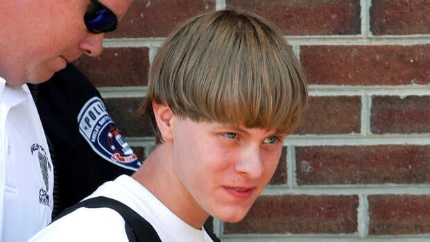 Police lead suspected shooter Dylann Roof into the courthouse in Shelby, North Carolina, on June 18, 2015.