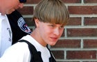 Police lead suspected shooter Dylann Roof into the courthouse in Shelby, North Carolina, on June 18, 2015. 
